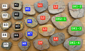 Collection of Slate Ikebana Vases with labelled numbers on a wooden surface
