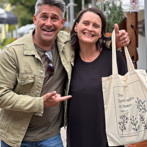 Market visitor Jamie Durie with The Slate Vase Tote Bag (and Mary)